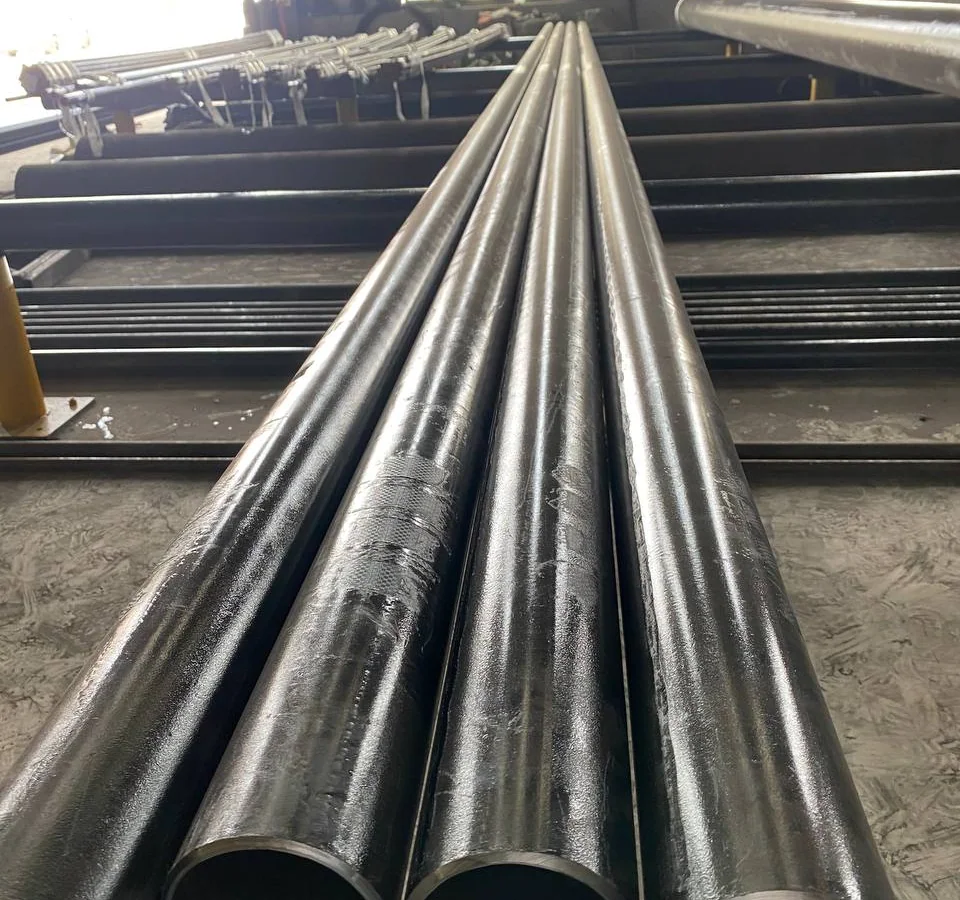 Carbon steel pipe bundles and pipe ends staged in a warehouse
