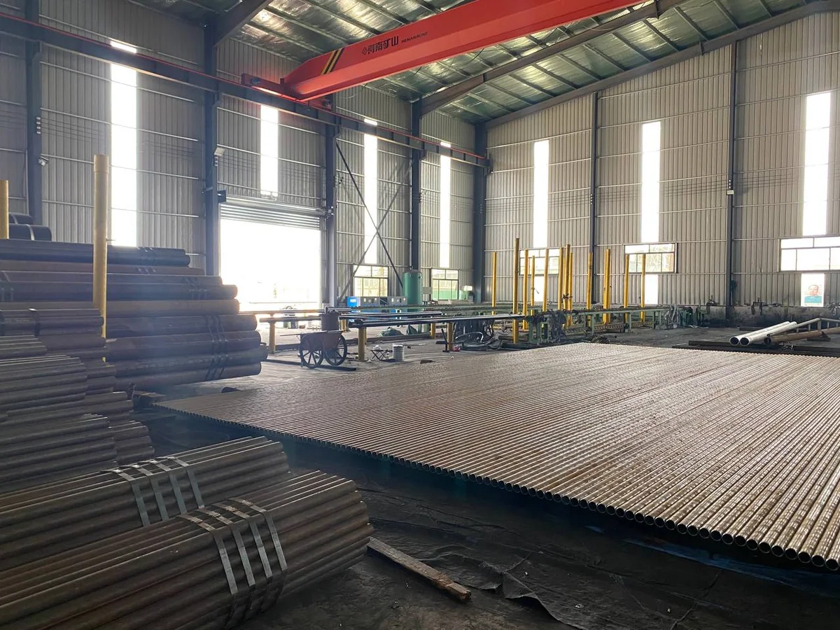 Carbon steel pipe bundles and pipe ends staged in a warehouse