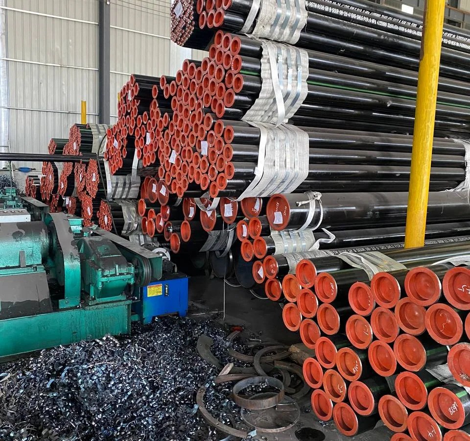 Carbon steel pipe bundles and pipe ends staged in a warehouse